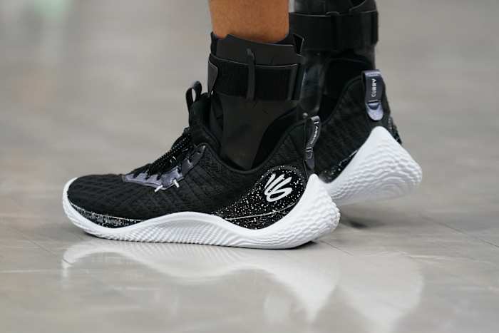 View of Stephen Curry's black and white Under Armour shoes.